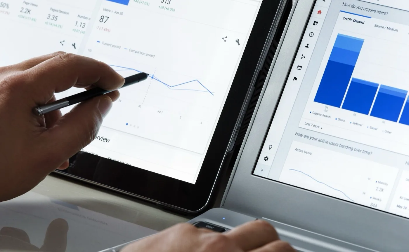 Website analytics being checked on a tablet and a laptop